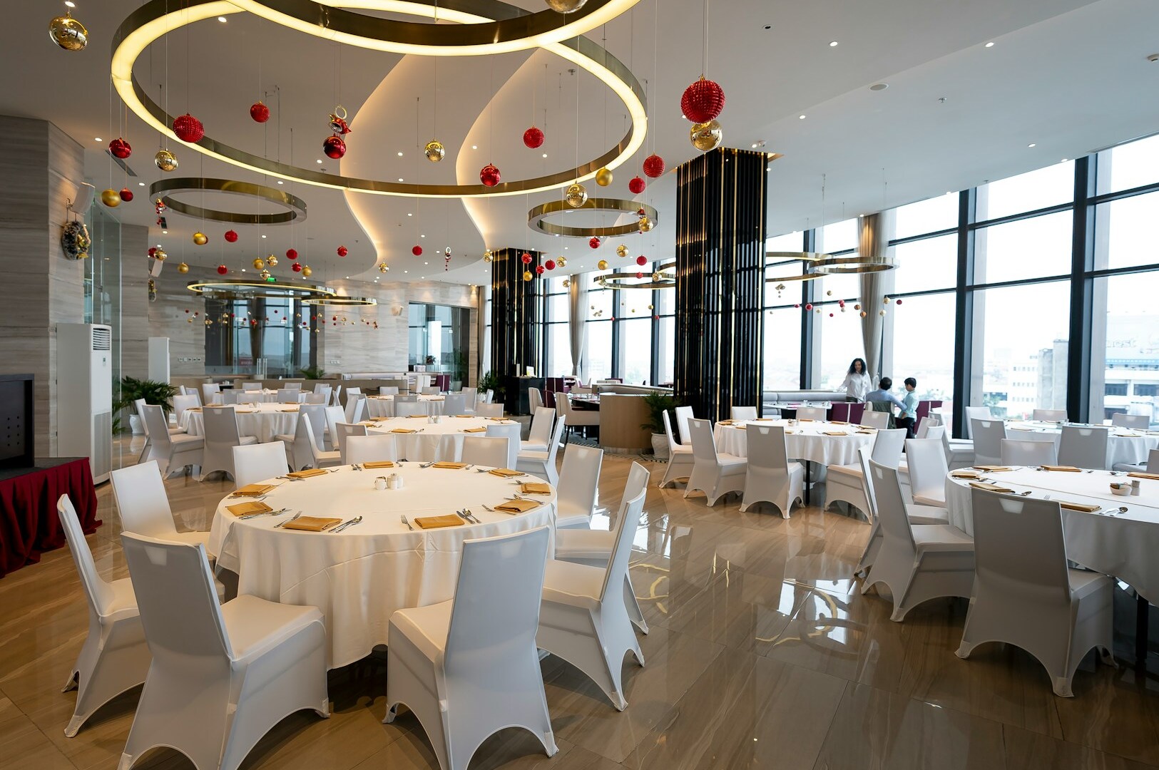 Elegant dining room with white tables and chairs, representing the ambiance of Singapore's finest dining establishments.