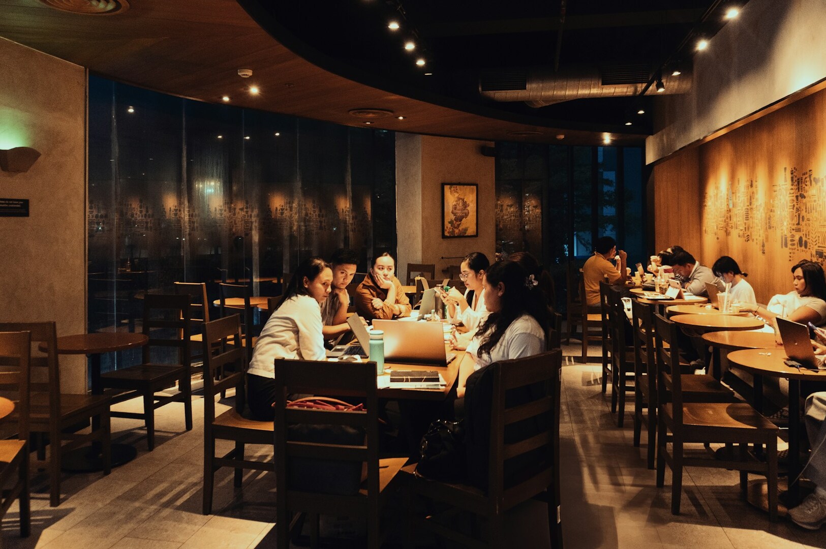 A bustling restaurant in Singapore with diners enjoying meals at tables, showcasing the vibrant dining scene.