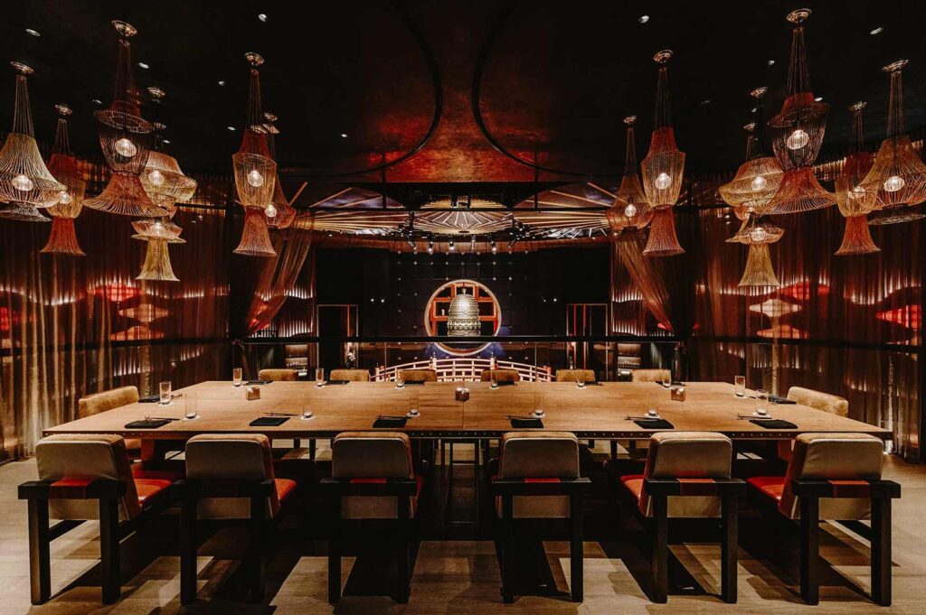 Elegant Asian-themed private dining room with warm lighting and luxurious décor