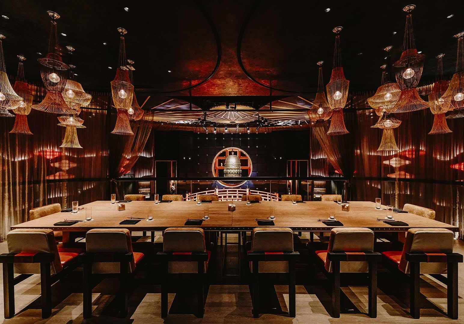 Elegant Asian-themed private dining room with warm lighting and luxurious décor