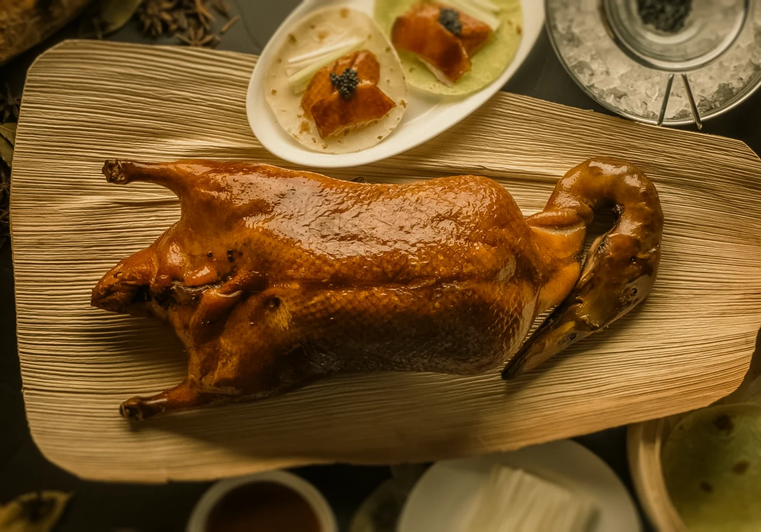 Overhead close-up of crispy Peking duck served with pancakes and caviar garnish at premium Chinese cuisine Singapore restaurant