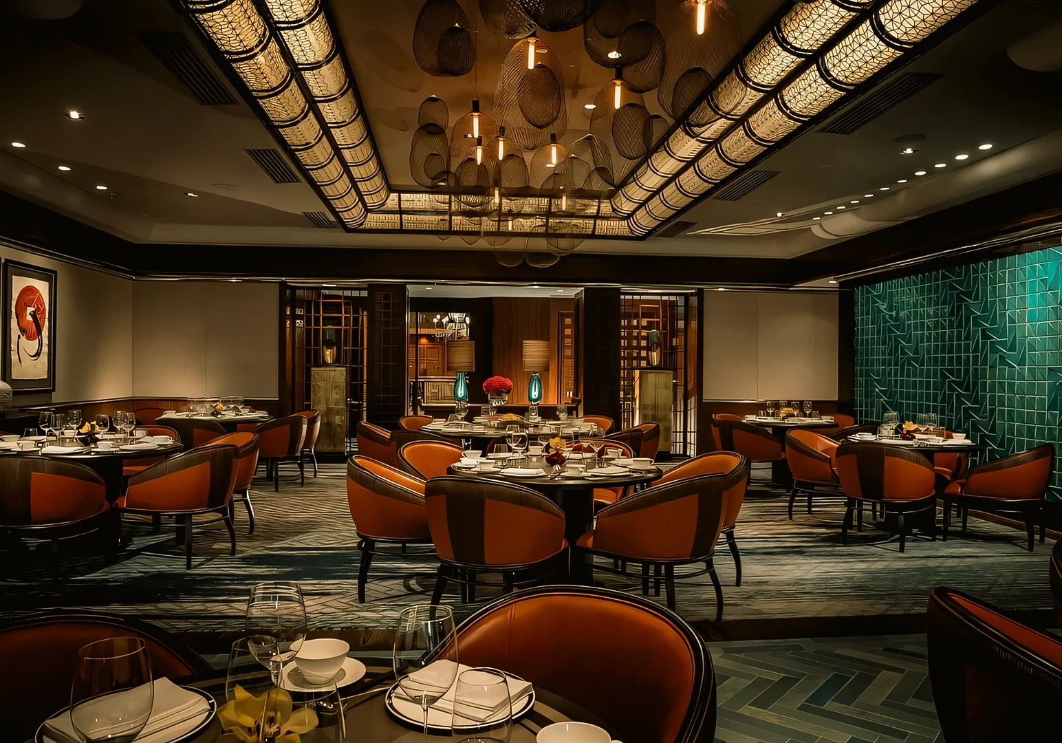Wide-angle interior shot of luxury Chinese fine dining restaurant in Singapore featuring modern Cantonese décor, round tables, and ambient lighting