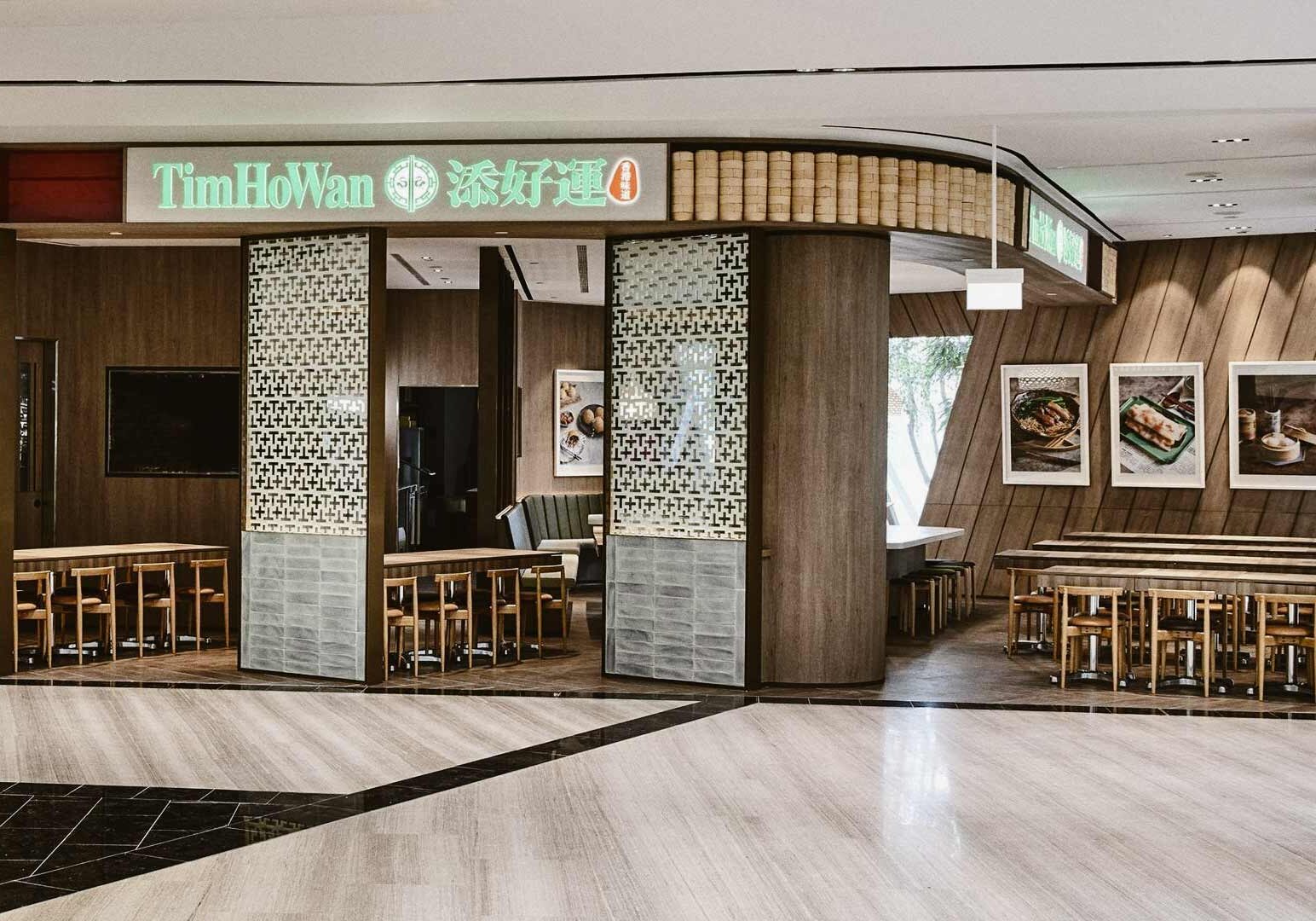 Tim Ho Wan restaurant entrance featuring modern wooden interiors and dim sum décor.