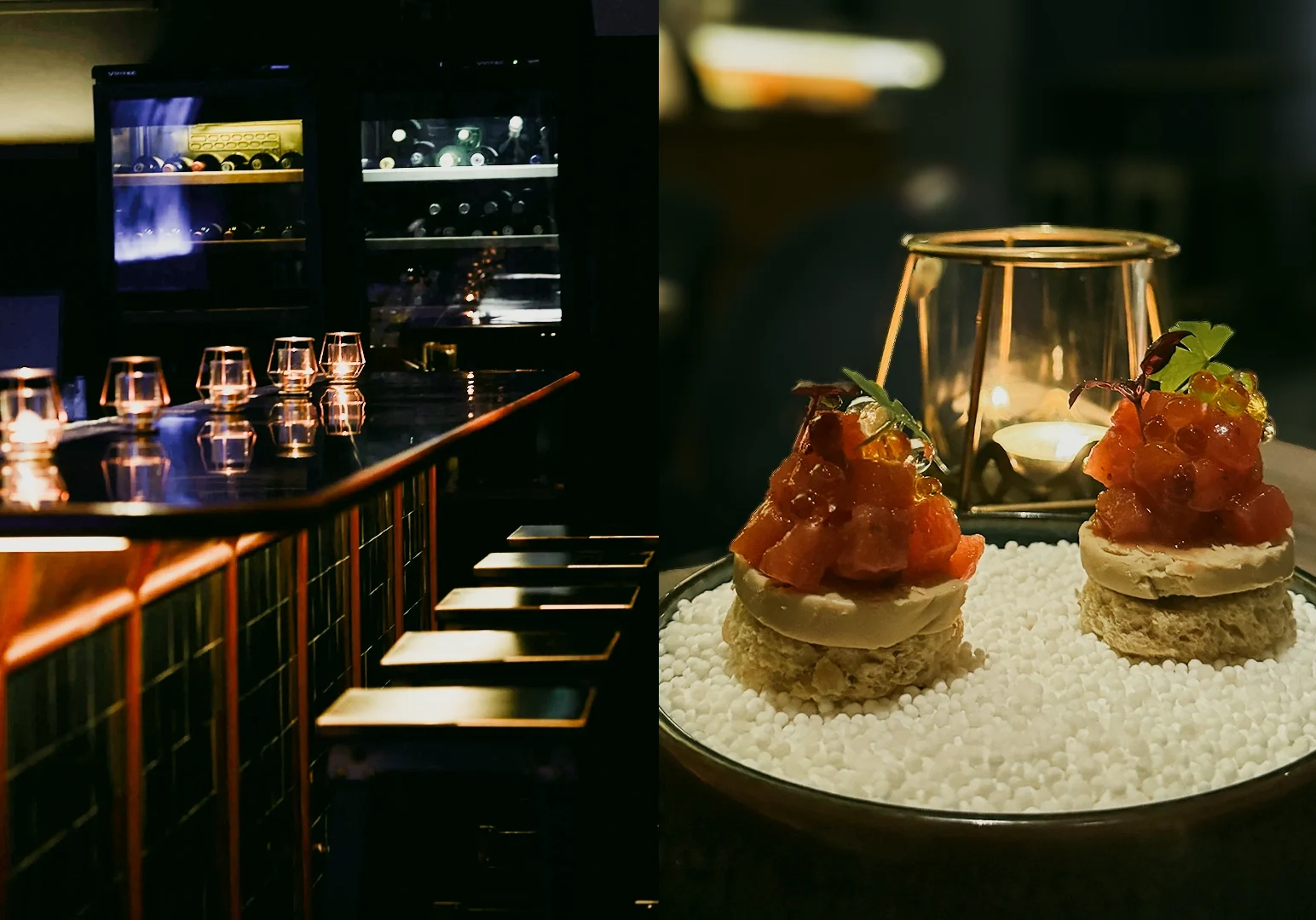 Left: Wide‑angle, eye‑level view of a modern, dimly lit bar interior with a reflective countertop, high stools, neatly arranged glassware, illuminated wine displays, and moody ambient lighting. Right: Close‑up, eye‑level angle of two elegant appetizers topped with diced seafood and micro‑greens, plated on a textured surface with a candle softly glowing in the background.