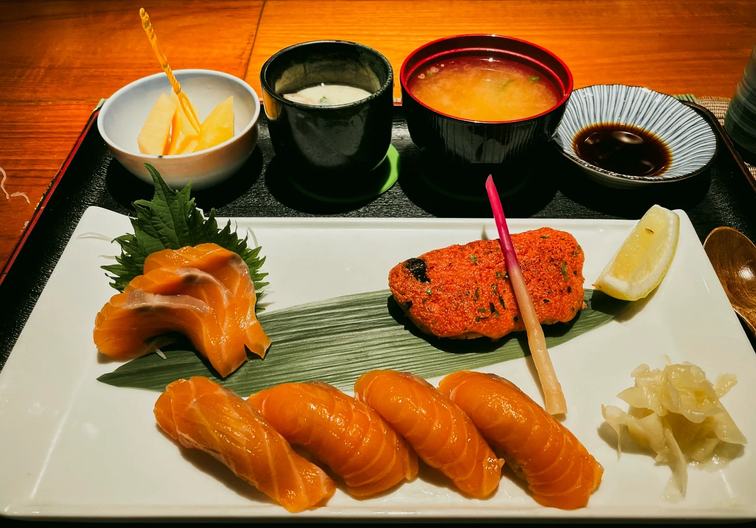 7 Cuppage Plaza Food Overhead close-up shot of salmon sashimi and sushi set meal with miso soup, chawanmushi, and pickled sides at authentic Japanese restaurant in Cuppage Plaza Singapore, showcasing fresh ingredients and refined plating